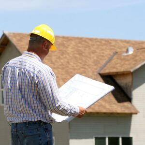 contractor reviewing roofing plans