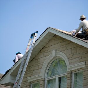 roofing professionals working on roof